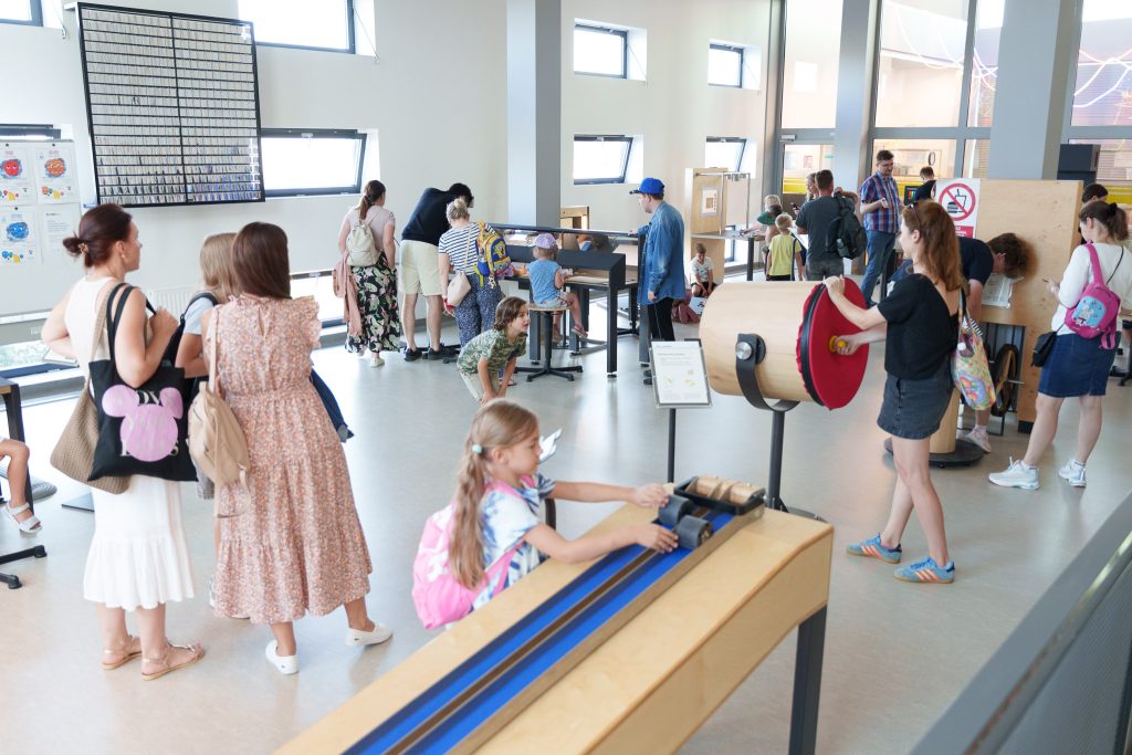 Visitors explore interactive exhibits in a science museum, engaging in educational activities and demonstrations.
